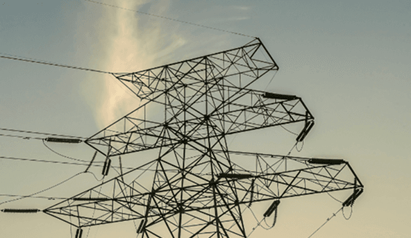 High-voltage transmission tower against the sky